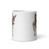 White ceramic coffee mug with an image of a donkey with wise owl sitting on it printed on both sides of the mug.