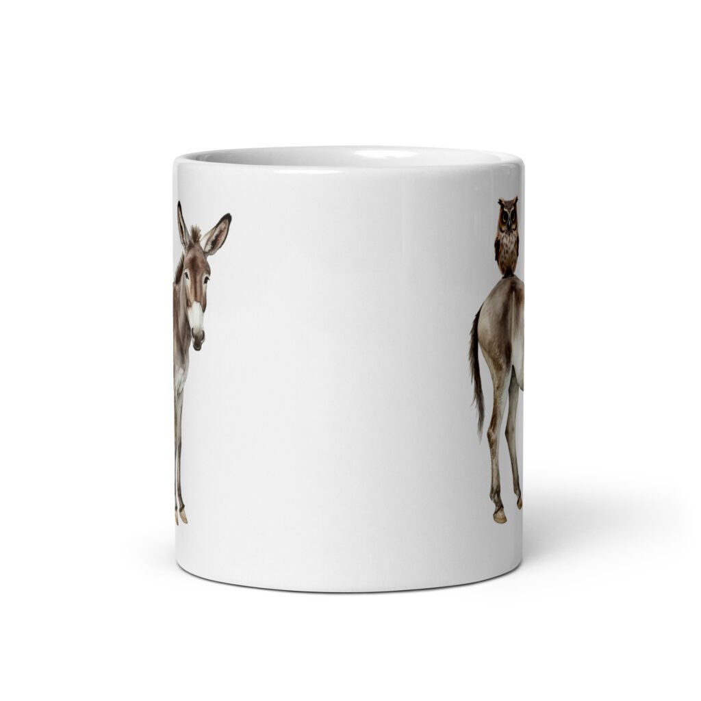 White ceramic coffee mug with an image of a donkey with wise owl sitting on it printed on both sides of the mug.