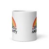 White ceramic coffee mug with a graphic of a rainbow and the words 'Spread negativity' printed on both sides.