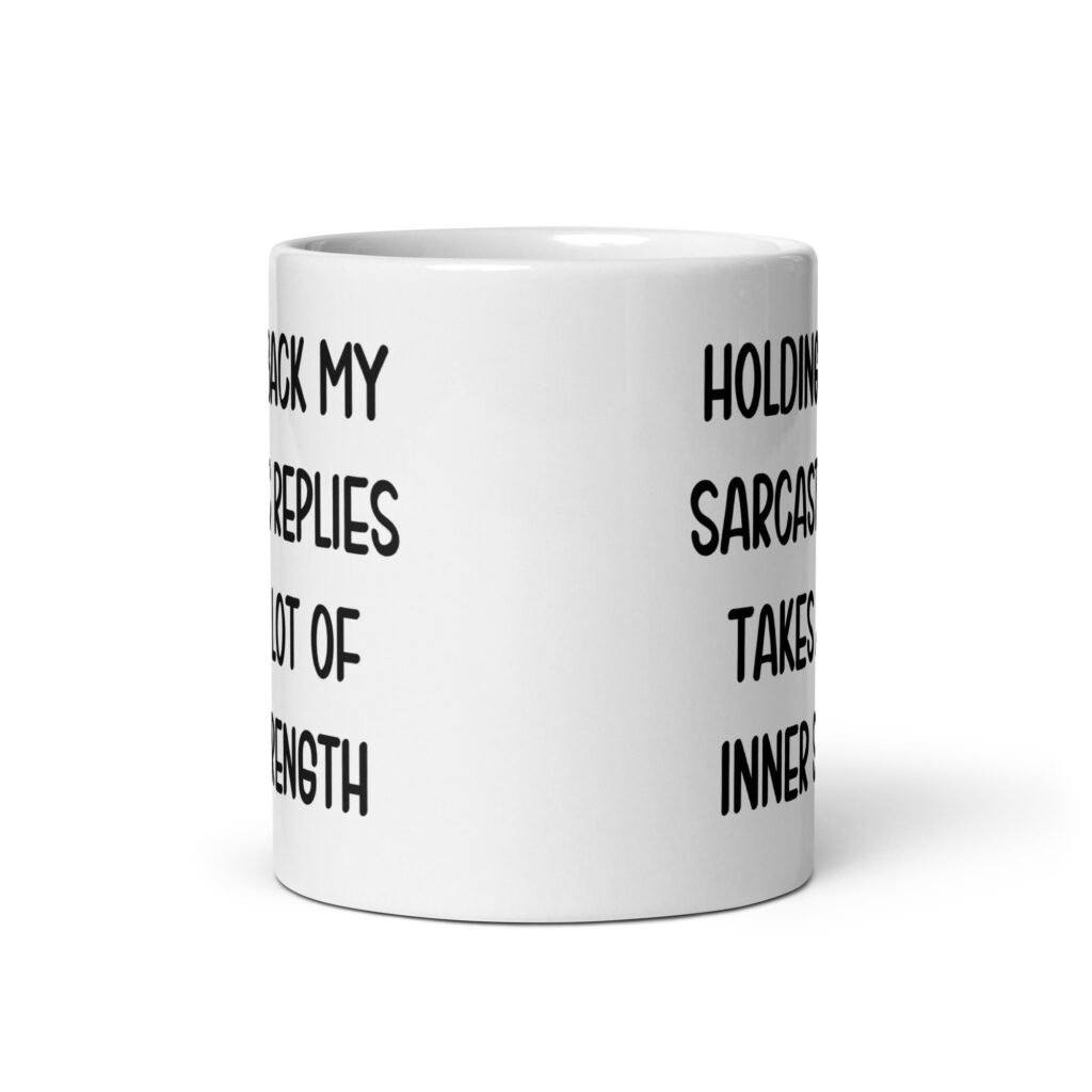 White ceramic mug with the phrase 'Holding back my sarcastic replies takes a lot of inner strength' printed on both sides of the mug.