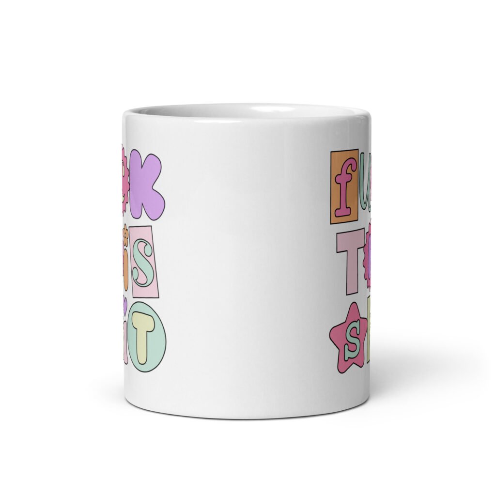 White ceramic coffee mug with colorful pastel font 'Fuck this shit' graphics printed on both sides.