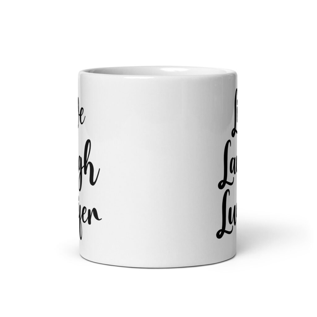White ceramic coffee mug with the parody phrase 'Live, Laugh, Lucifer' printed on both sides.