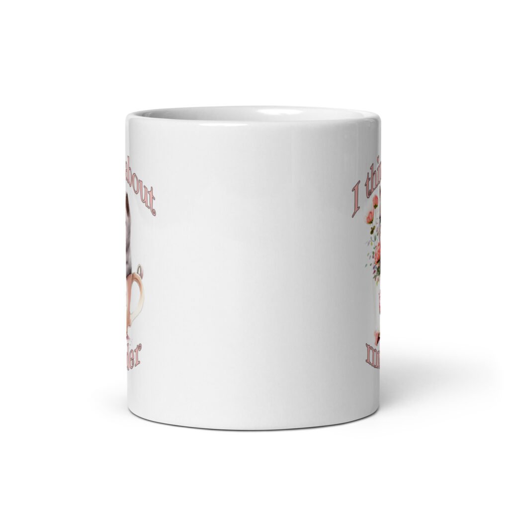White ceramic mug that says 'I think about murder' with image of cute fluffy kitten sitting in a teacup printed on both sides.