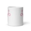 White ceramic coffee mug with with image of a pink uterus flipping middle finger graphic printed on both sides.