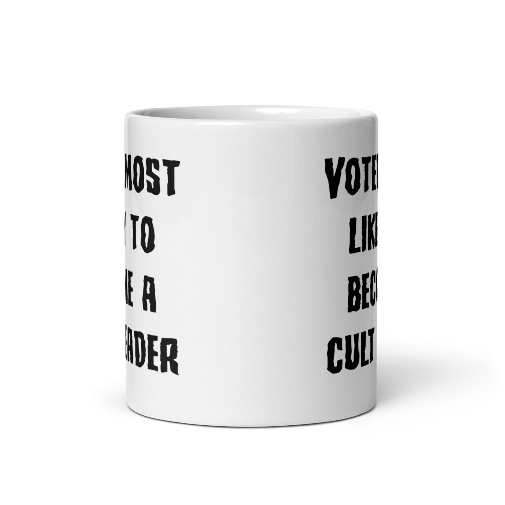 White ceramic coffee mug with the text 'Voted most likely to become a cult leader' printed on both sides.
