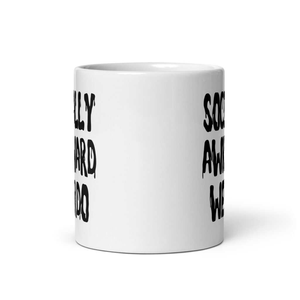 White ceramic coffee mug with the text 'Socially awkward weirdo' printed on both sides.