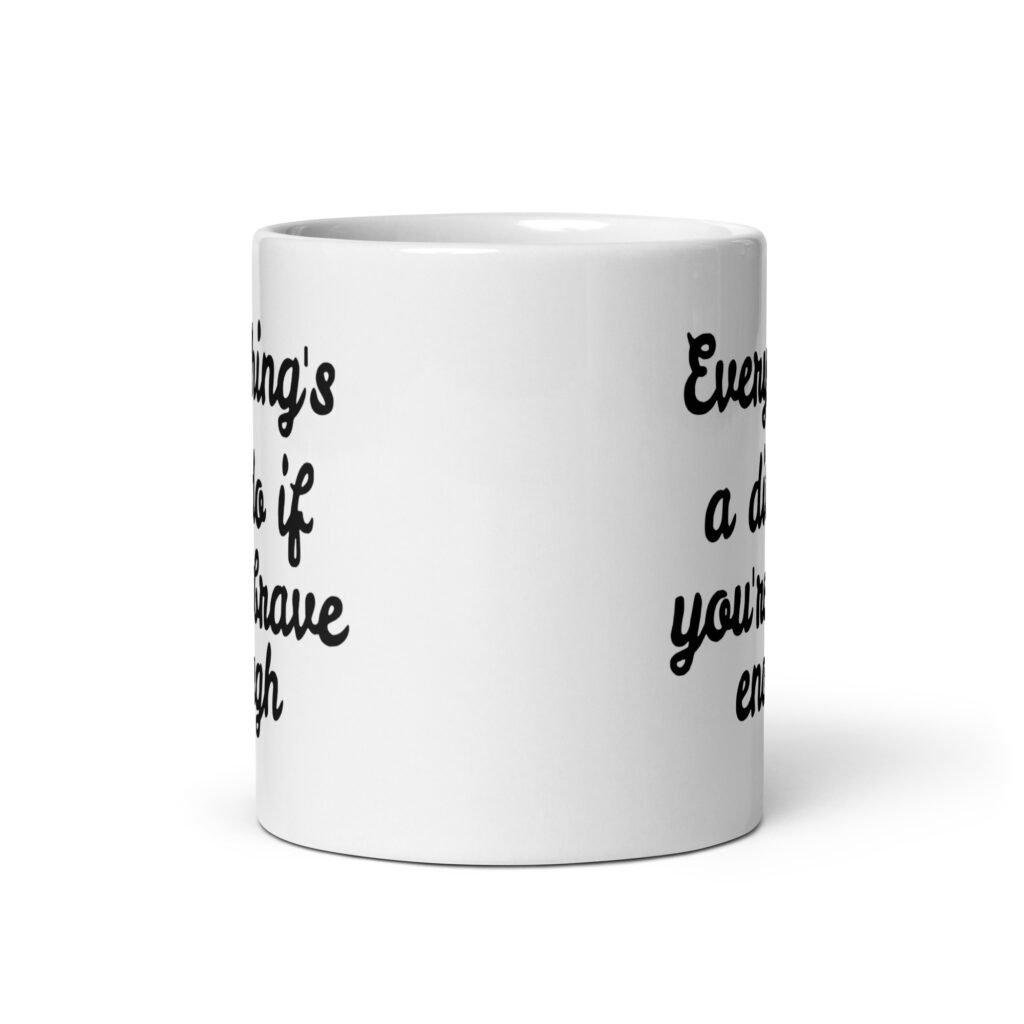 White ceramic coffee mug with the text 'Everything's a dildo if you're brave enough' printed on both sides.