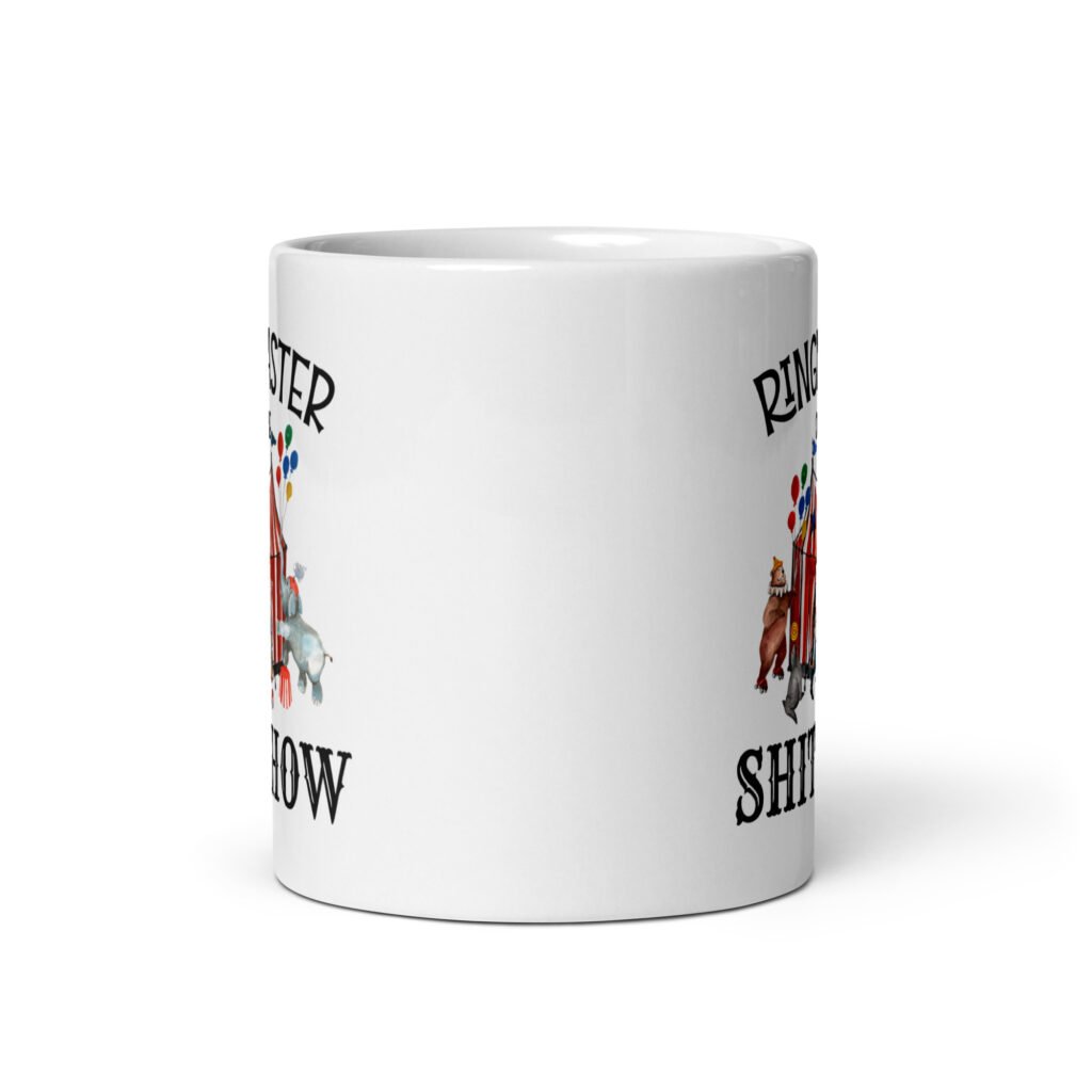 White ceramic coffee mug with a circus theme graphic and the text 'Ringmaster of the Shitshow' printed on both sides.