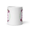White ceramic coffee mug that has a colorful minimalistic style line drawing floral wreath with the text 'Sometimes I pee a little when I laugh' printed in the center of the wreath. The graphics are printed on both sides of the mug.