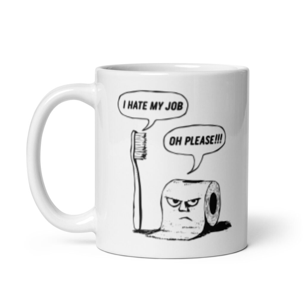 White ceramic mug with a cartoon graphic on both sides. The cartoon is a line drawing of a toothbrush and roll of toilet paper. Both have speech bubbles above . The toothbrush says 'I hate my job' and the toilet paper says 'Oh please.'