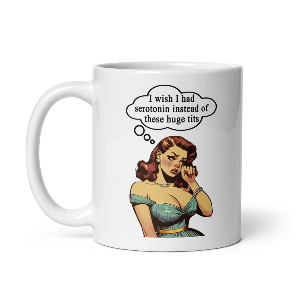 White ceramic coffee mug with an image of a busty pin-up lady with thought bubble that says 'I wish I had serotonin instead of these huge tits' printed on both sides of the mug.