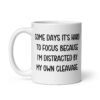 White ceramic mug with the phrase 'Some days it's hard to focus because I'm distracted by my own cleavage' printed on both sides.