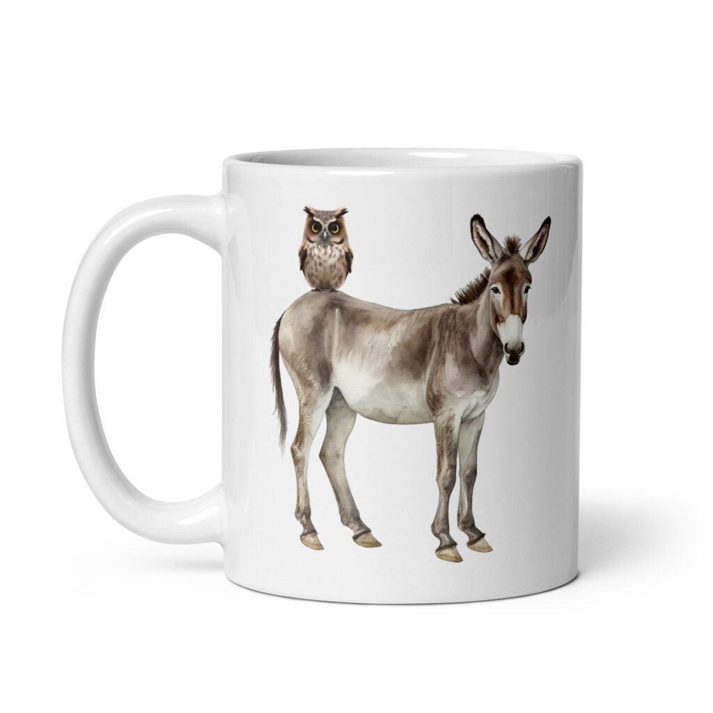 White ceramic coffee mug with an image of a donkey with wise owl sitting on it printed on both sides of the mug.