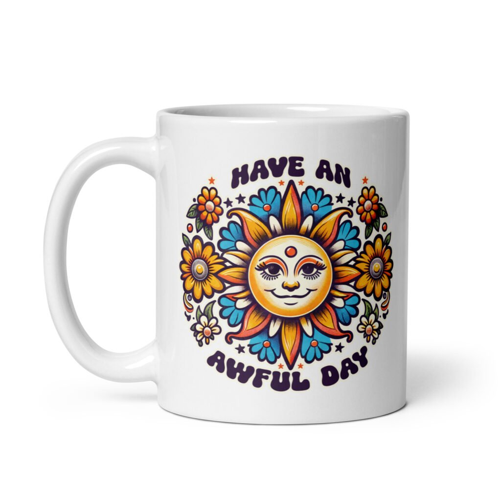 White ceramic coffee mug with a sun graphic and the text 'Have an awful day' printed on both sides.