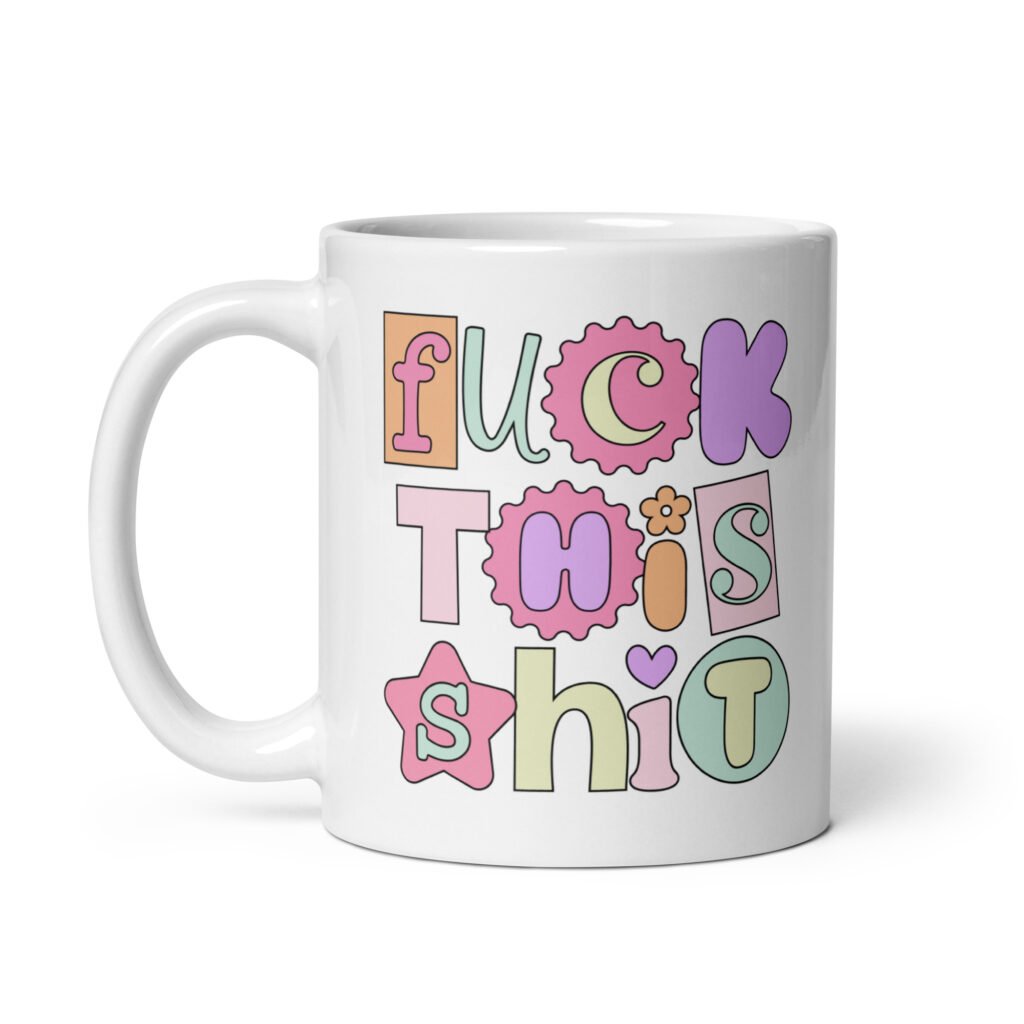 White ceramic coffee mug with colorful pastel font 'Fuck this shit' graphics printed on both sides.