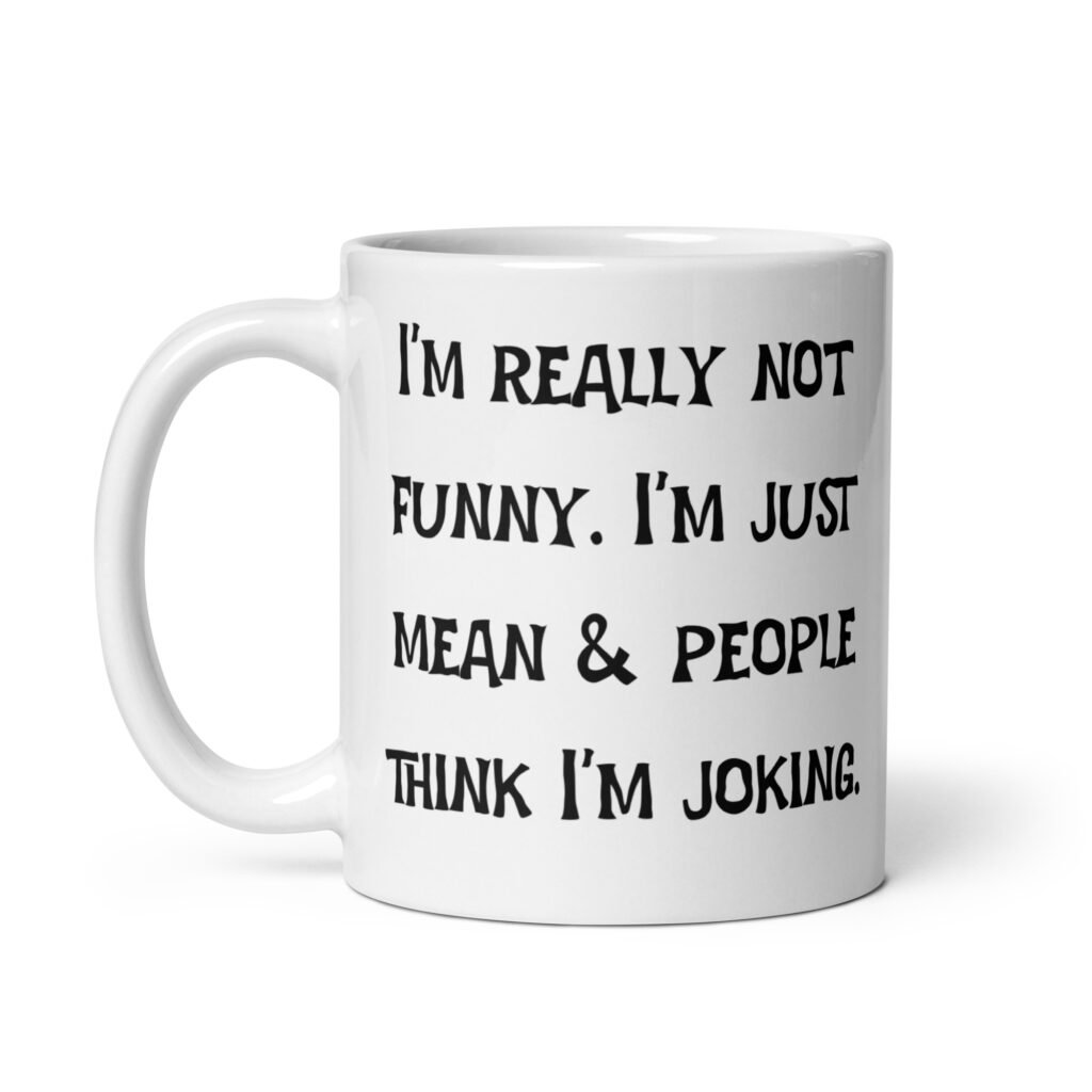 White ceramic mug with the text 'I'm really not funny. I'm just mean & people think I'm joking' printed on both sides.