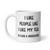 White ceramic coffee mug with the phrase 'I like people like I like my tea. In a bag & underwater' printed on both sides.