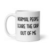 White ceramic coffee mug with the text 'Normal people scare the crap out of me' printed on both sides.