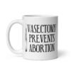 White ceramic coffee mug that has an image of a surgical scalpel and the phrase 'Vasectomy prevents abortion' printed on both sides.