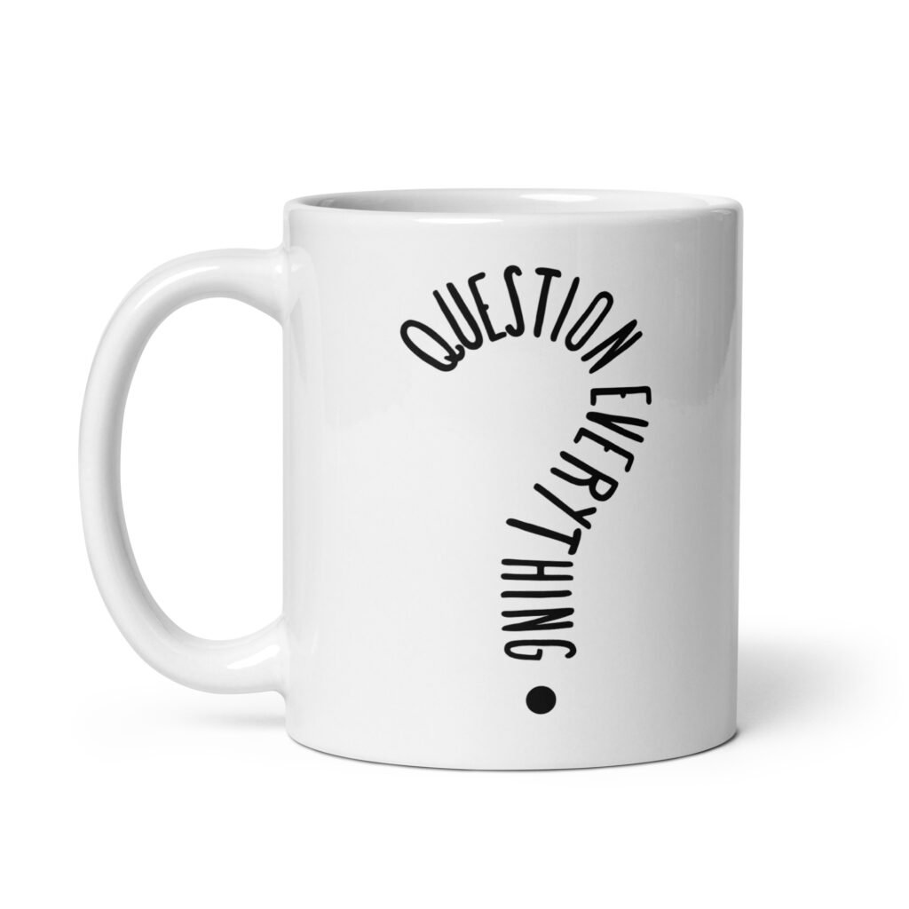 White ceramic coffee mug with the text 'Question everything' printed on both sides. The words are in the shape of a question mark.