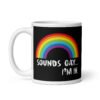 Black and white ceramic coffee mug that has an image of a rainbow and the text 'Sounds gay... I'm in.' printed on both sides.