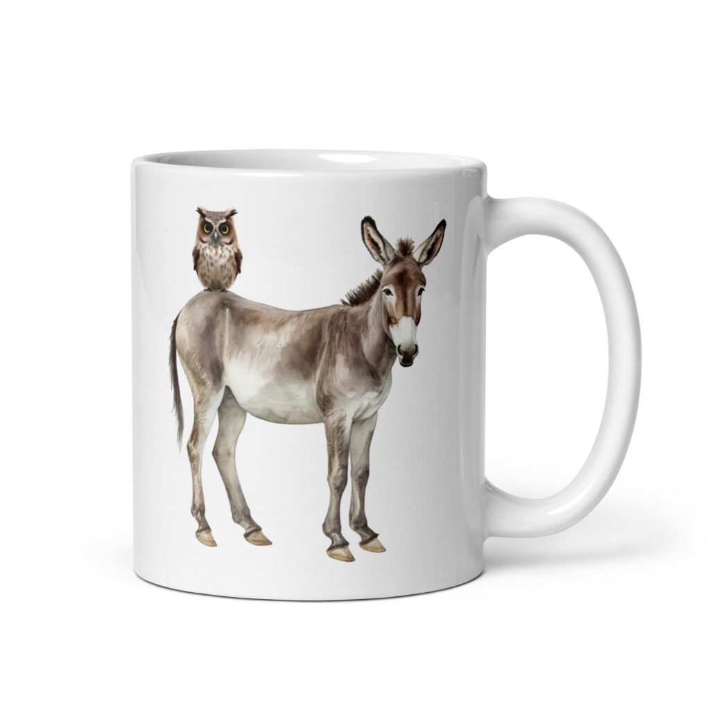 White ceramic coffee mug with an image of a donkey with wise owl sitting on it printed on both sides of the mug.