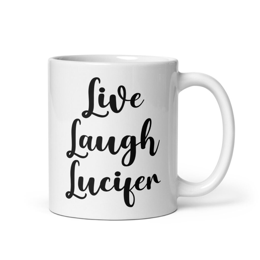 White ceramic coffee mug with the parody phrase 'Live, Laugh, Lucifer' printed on both sides.