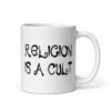 White ceramic coffee mug with the text 'Religion is a cult' printed on both sides.