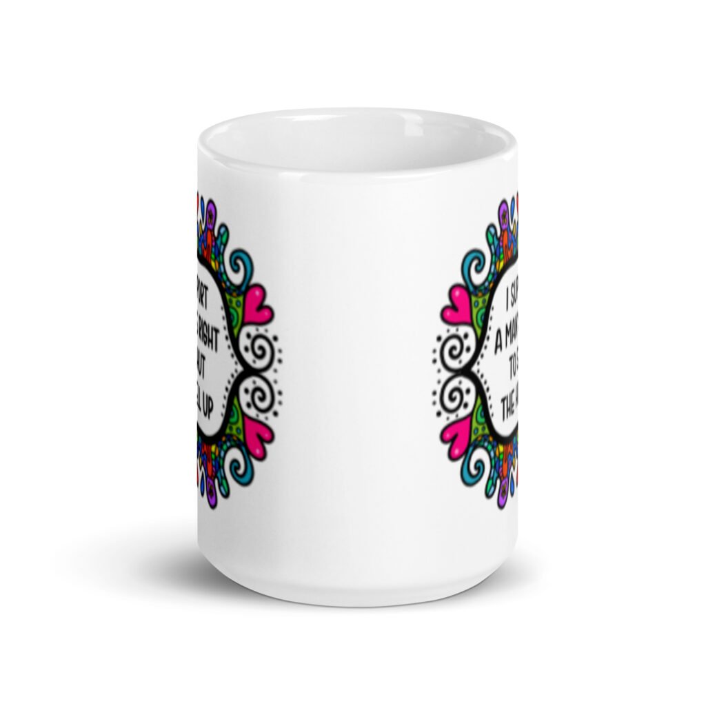 White ceramic mug with a colorful doodle graphic and the words 'I support a man's right to shut the hell up.' The design is printed on both sides of the mug.
