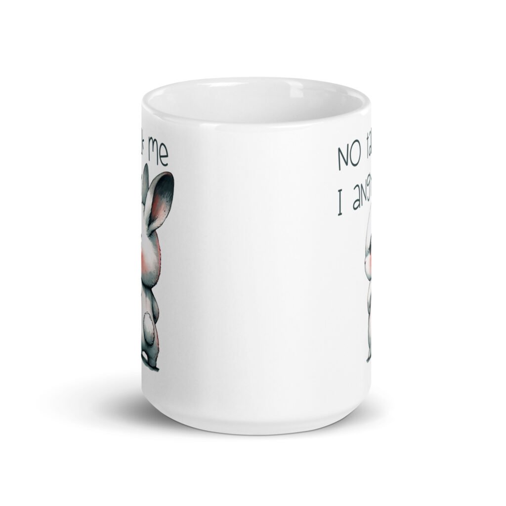 White ceramic coffee mug with an image of an angry bunny and the text 'No talk me I angy' printed on both sides of the mug.