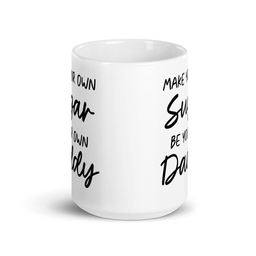 White ceramic coffee mug with the text 'Make your own sugar Be your own Daddy' printed on both sides.