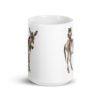 White ceramic coffee mug with an image of a donkey with wise owl sitting on it printed on both sides of the mug.