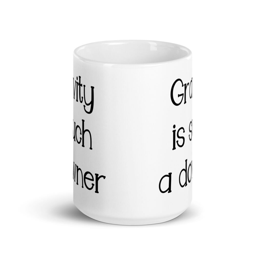 White ceramic coffee mug with the text 'Gravity is such a downer' printed on both sides.