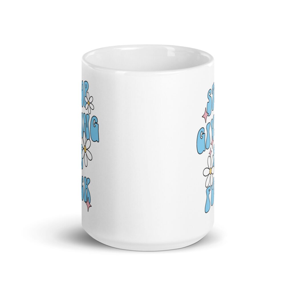 White ceramic coffee mug with a retro daisy and star design and the text 'Stop giving a fuck' printed on both sides.