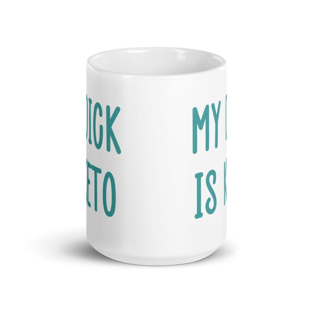 White ceramic coffee mug with the text 'My dick is keto' printed on both sides in turquoise font.