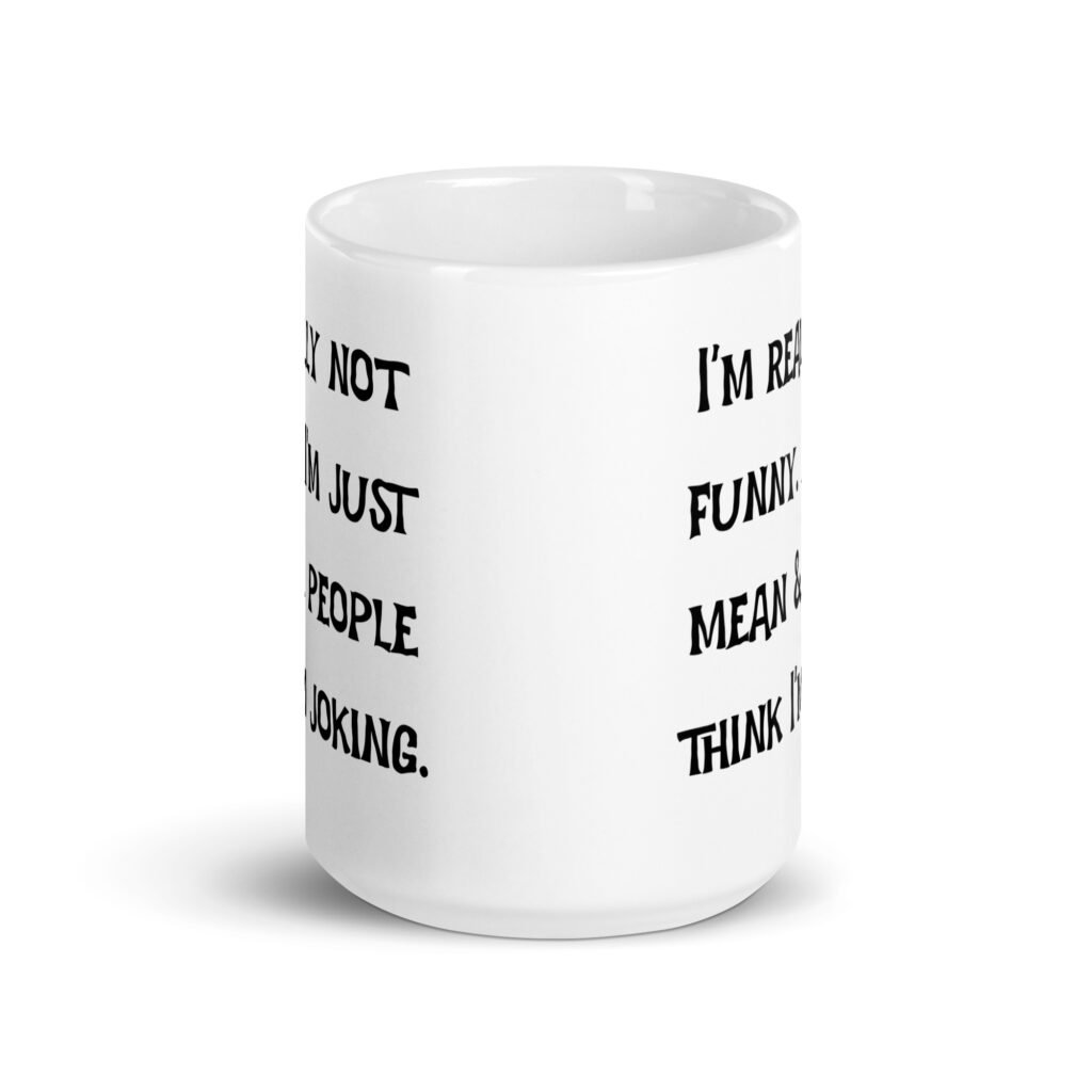White ceramic mug with the text 'I'm really not funny. I'm just mean & people think I'm joking' printed on both sides.