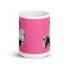 White ceramic coffee mug with pink color wrapped around. The mug has a graphic of an angry looking retro woman holding a knife and a sign. The sign says 'Tell me to calm down. I dare you.' The graphic is printed on both sides of the mug.