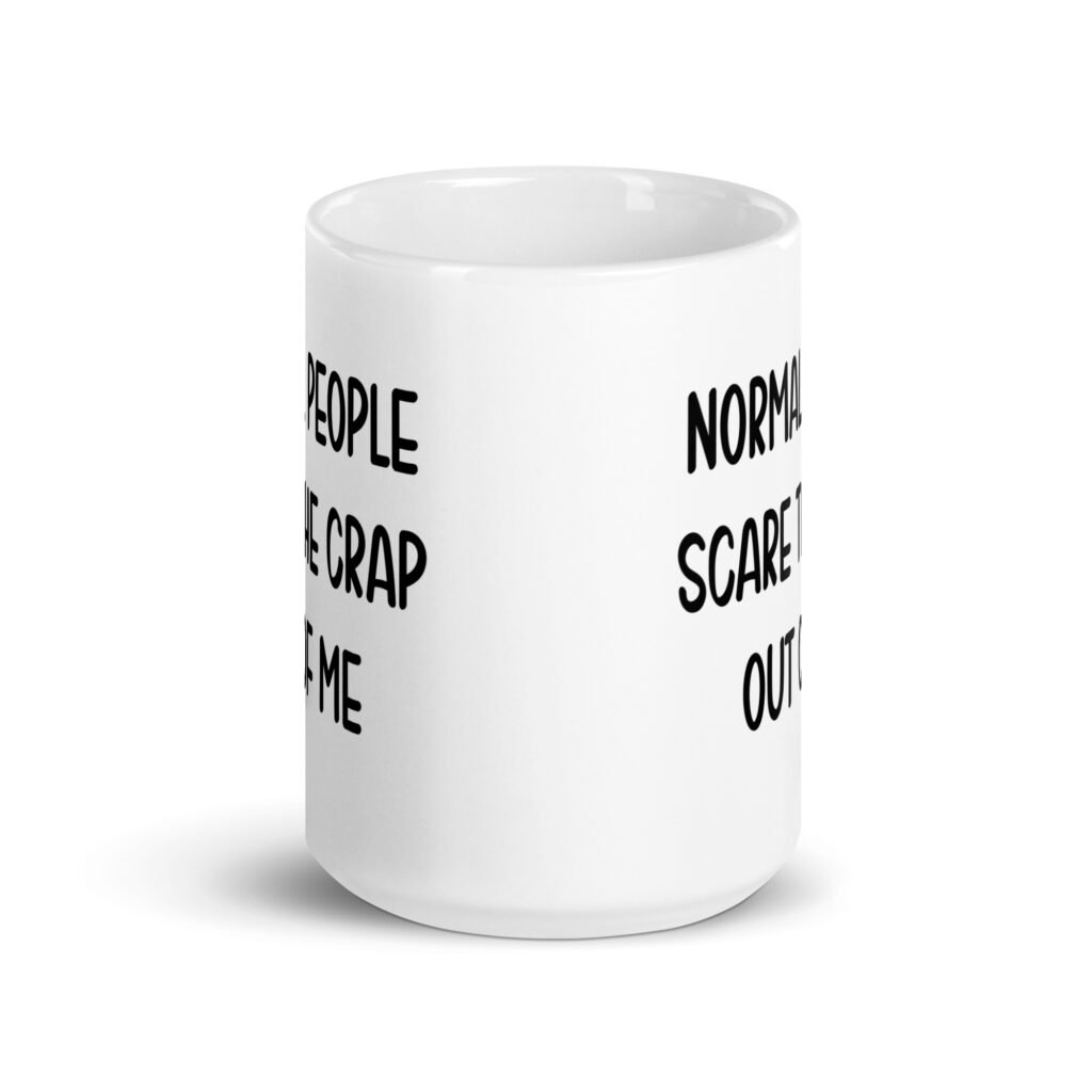 White ceramic coffee mug with the text 'Normal people scare the crap out of me' printed on both sides.