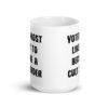White ceramic coffee mug with the text 'Voted most likely to become a cult leader' printed on both sides.