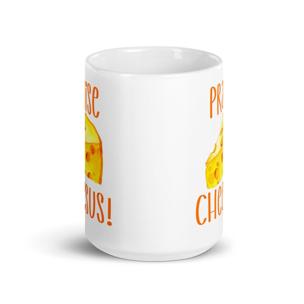 White ceramic coffee mug with funny graphics of a piece of swiss cheese and the text 'Praise Cheesus' printed on both sides in yellow and orange.