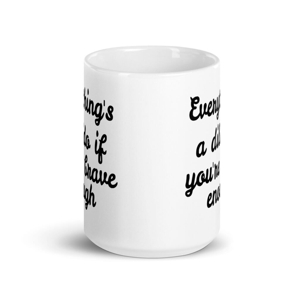 White ceramic coffee mug with the text 'Everything's a dildo if you're brave enough' printed on both sides.