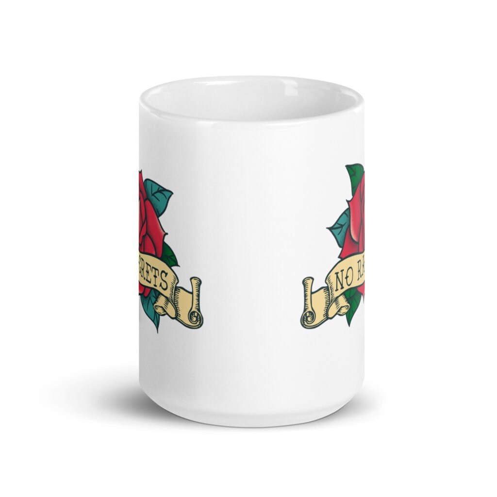 White ceramic coffee mug with funny image of an old school rose flash tattoo with the words 'No ragrets' intentionally misspelled. The graphics are printed on both sides of the mug.