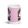 Pink and white ceramic coffee mug with a graphic of a kawaii style unicorn and a pastel rainbow with the text 'Everything is fucked' printed on both sides. The background is pink.