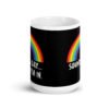 Black and white ceramic coffee mug that has an image of a rainbow and the text 'Sounds gay... I'm in.' printed on both sides.