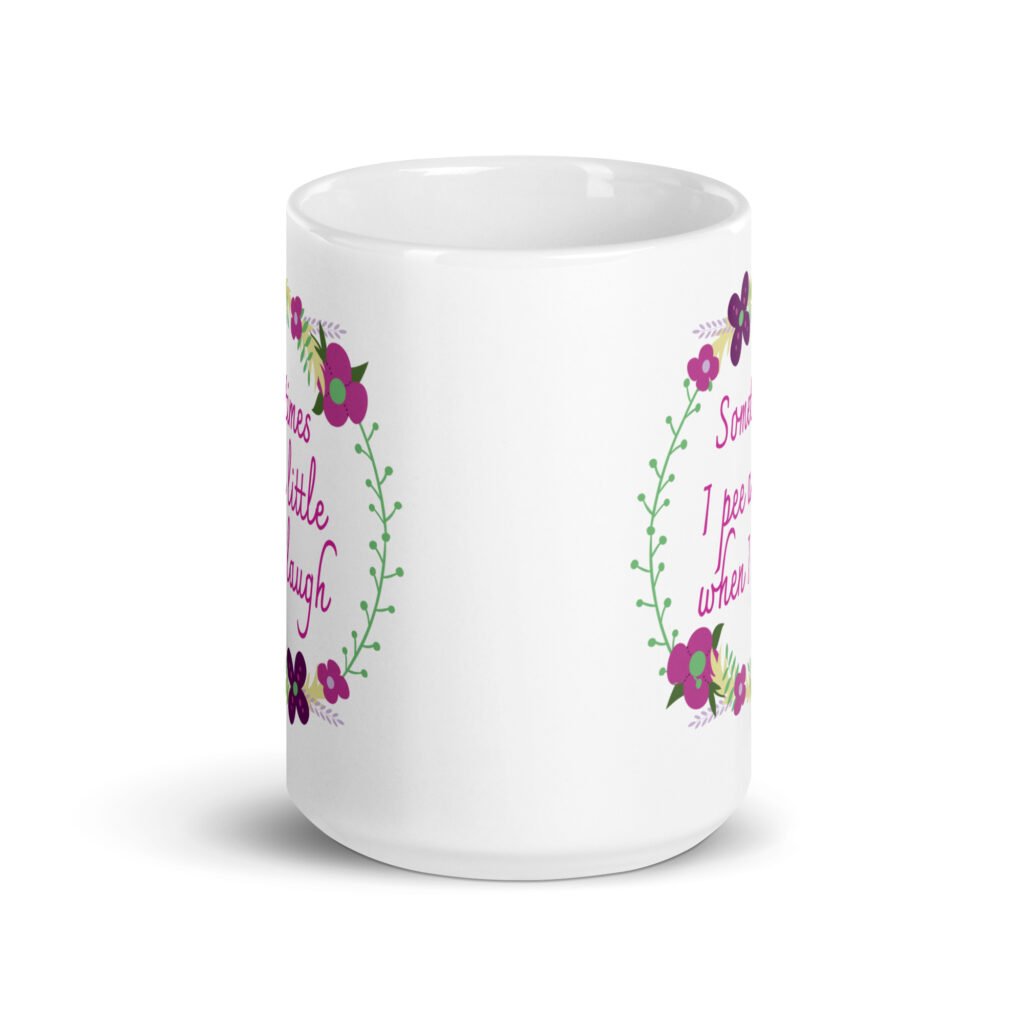 White ceramic coffee mug that has a colorful minimalistic style line drawing floral wreath with the text 'Sometimes I pee a little when I laugh' printed in the center of the wreath. The graphics are printed on both sides of the mug.