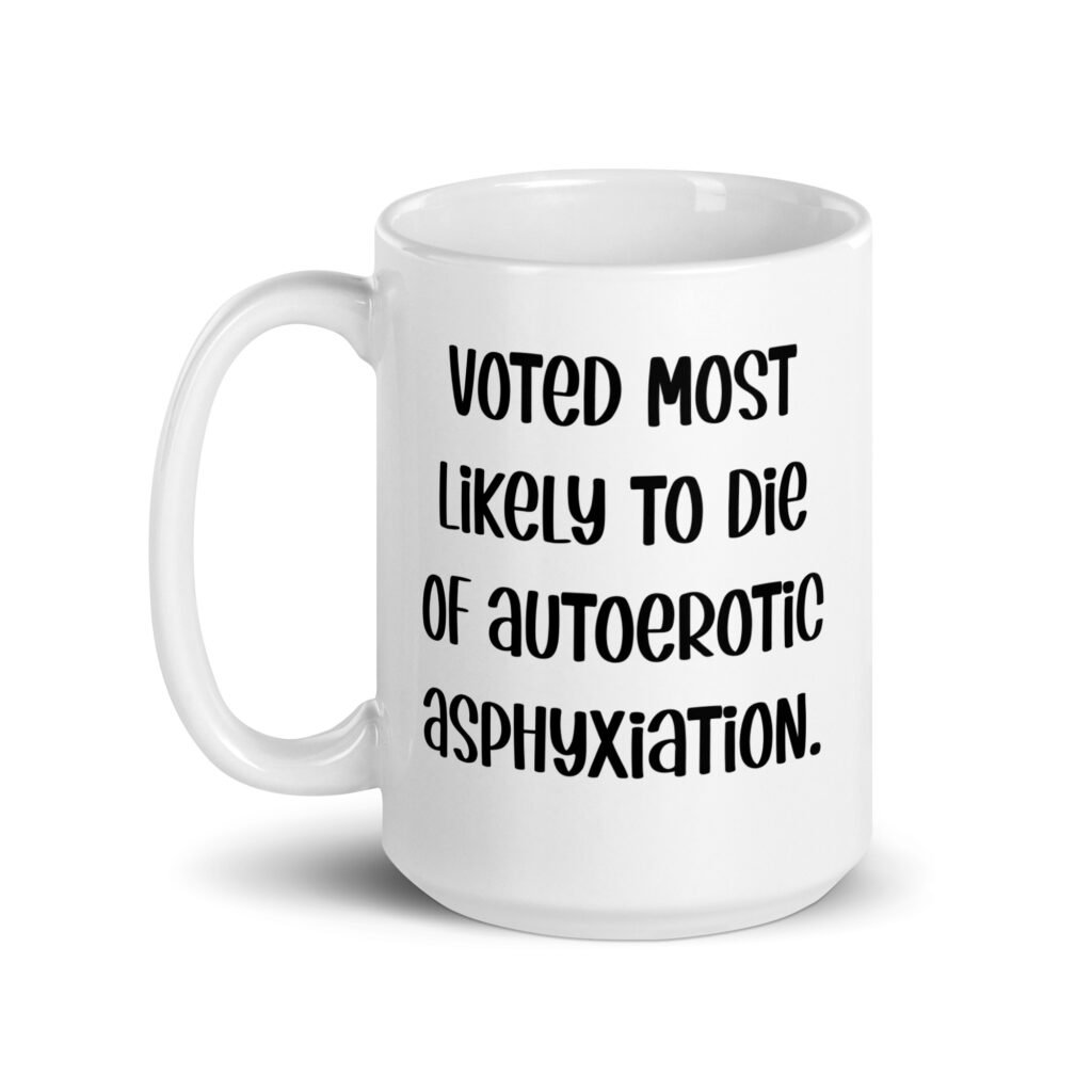 White ceramic mug with the text 'Voted most likely to die of autoerotic asphyxiation.' printed on both sides.