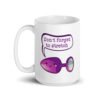 White ceramic coffee mug that has image of a purple anal plug with a smile face. There is a speech bubble above with the words 'Don't forget to stretch'. The graphics are printed on both sides of the mug.