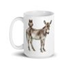 White ceramic coffee mug with an image of a donkey with wise owl sitting on it printed on both sides of the mug.