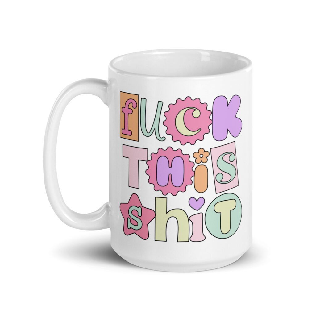 White ceramic coffee mug with colorful pastel font 'Fuck this shit' graphics printed on both sides.