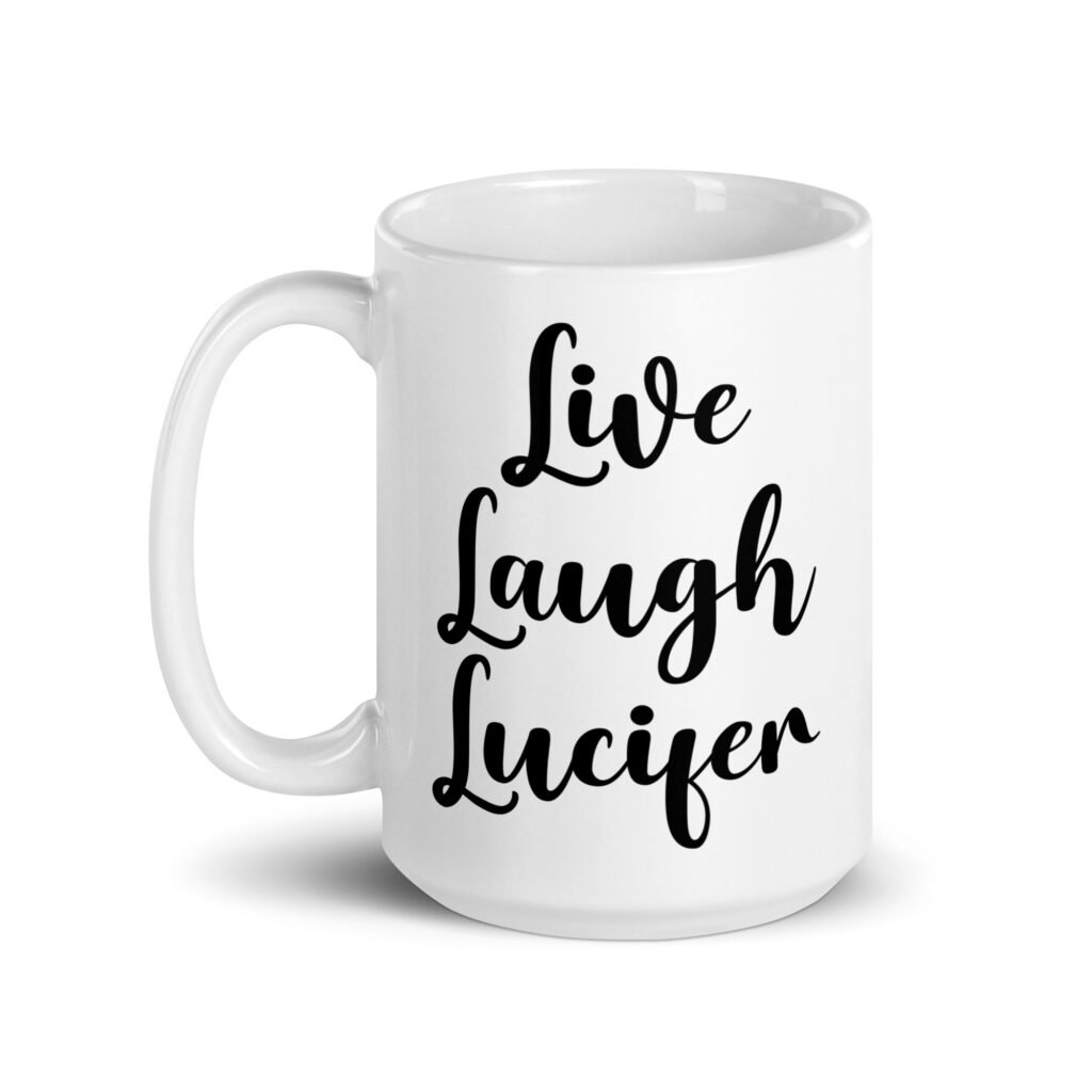 White ceramic coffee mug with the parody phrase 'Live, Laugh, Lucifer' printed on both sides.